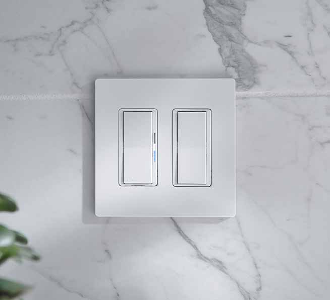 Diva smart dimmer switch and Claro smart accessory switch mounted on backsplash under a 2-gang wallplate.