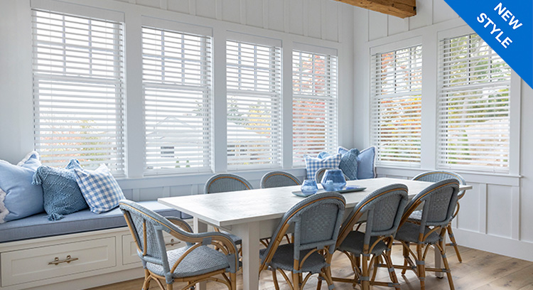 Dining room with Caséta smart shades and blinds controlling natural light through multiple windows