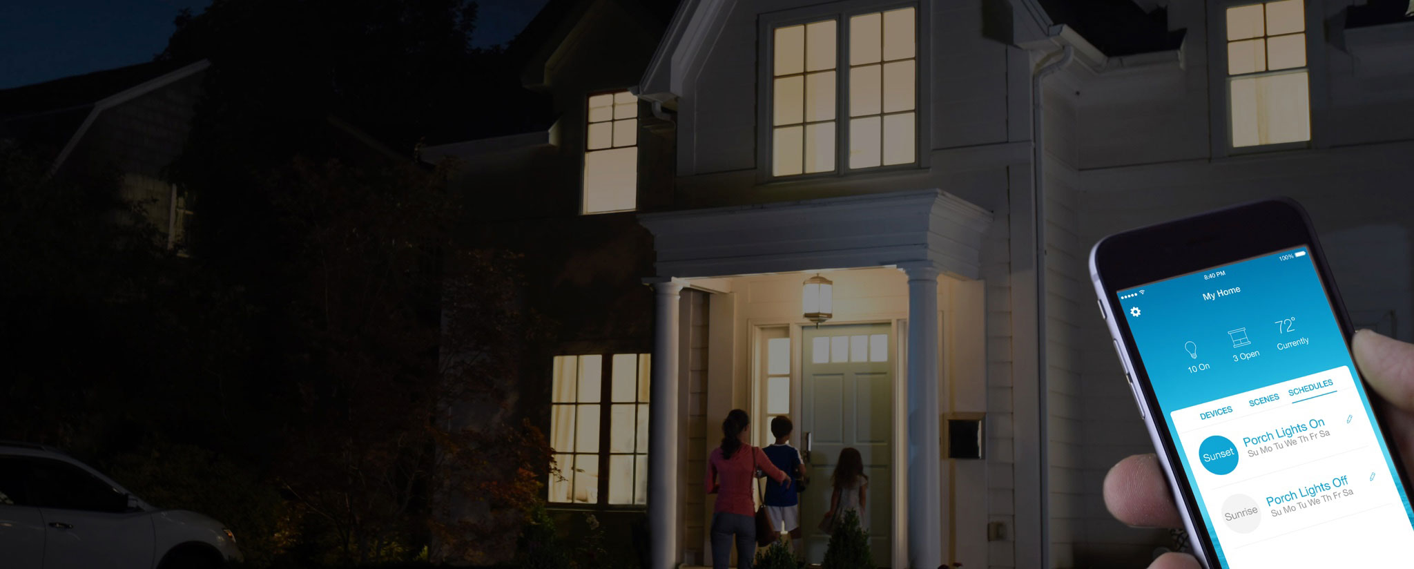 Install smart light switch app on phone, family entering front door in background