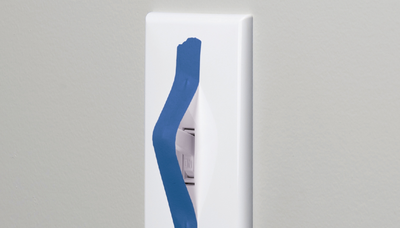 Standard light switch with tape covering the switch
